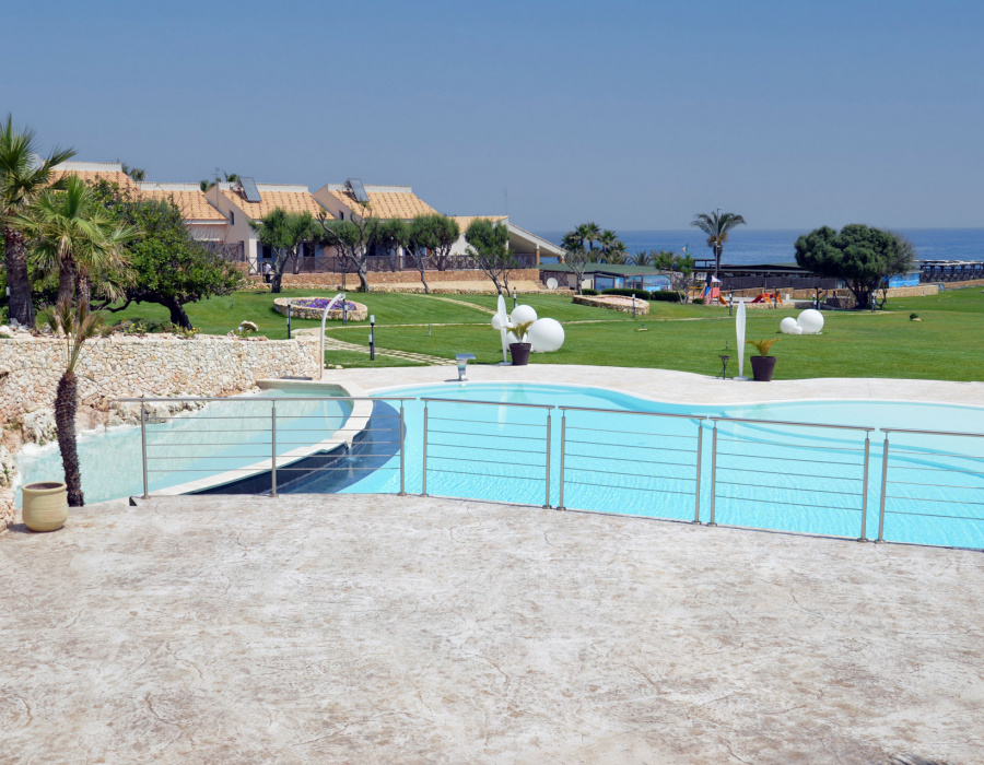 Plam Stampable, stamped concrete floor white color, tawny shades. Hotel Capo Campolato, Siracusa, Italy